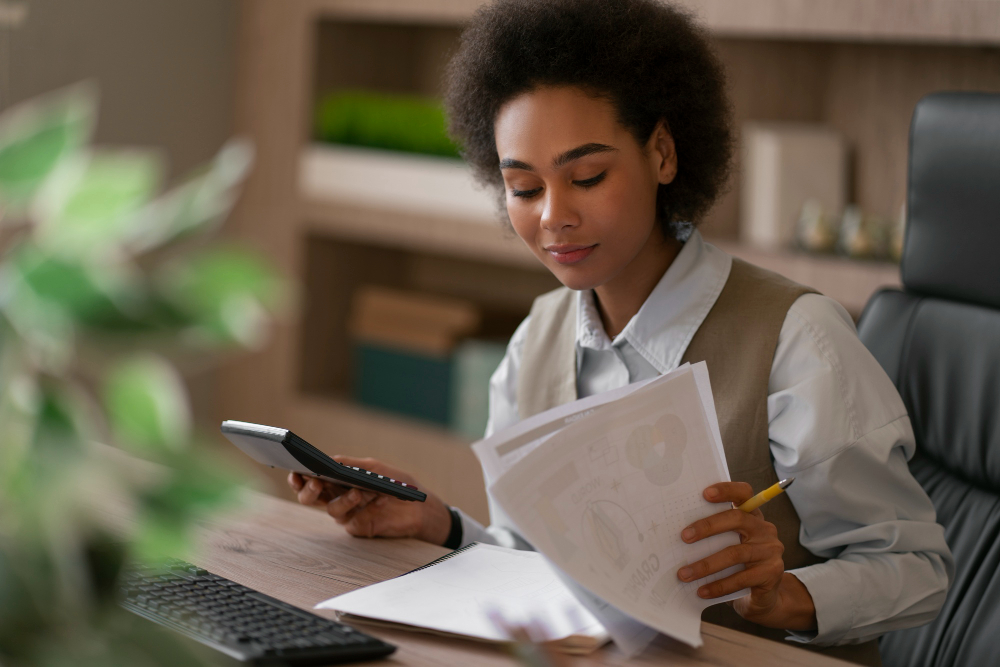 a woman exhibiting a financial habit of disciplined calculations
