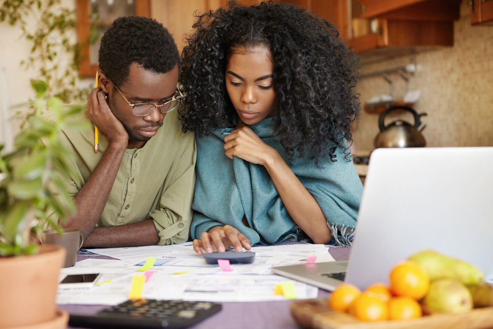 a couple drafting a financial budget