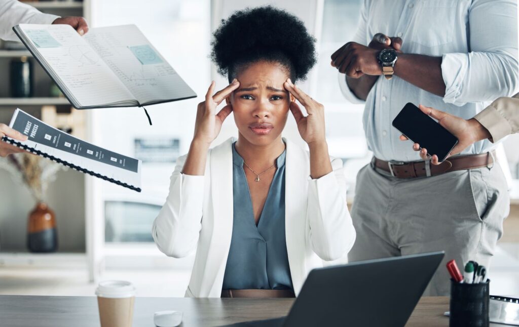 A stressed Business Manager at work.